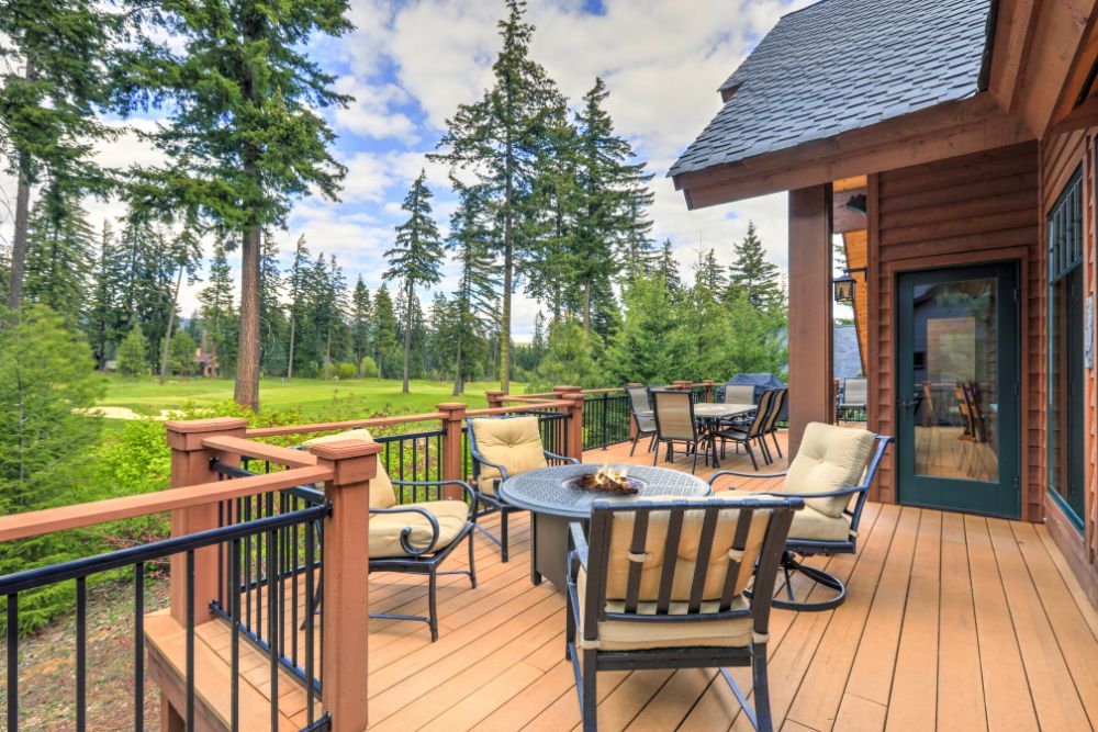 Comfortable outdoor wood deck with seating and dining areas